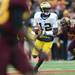 Michigan quarterback Devin Gardner holds onto the ball as he looks to pass in the fourth quarter against Minnesota at TCF Bank Stadium in Minneapolis, Minn. on Saturday. Melanie Maxwell I AnnArbor.com
